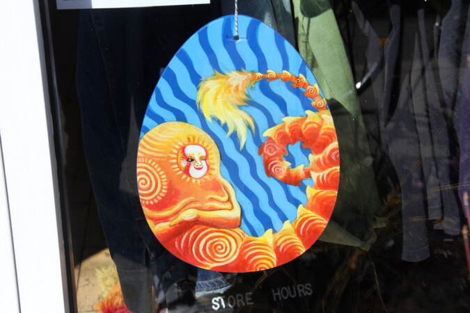 An egg design shows a mereperson or other mythical creature.