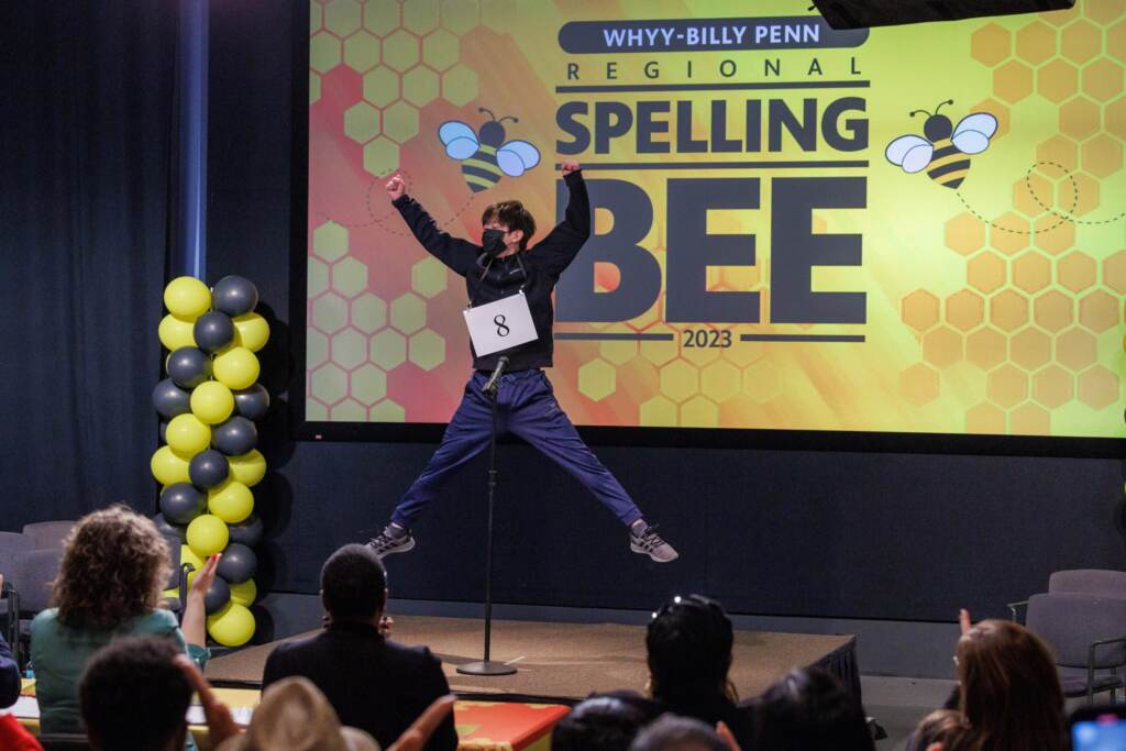 WHYY-Billy Penn Regional Spelling Bee 2023 winner Jack Jiang leaps into the air after winning first place