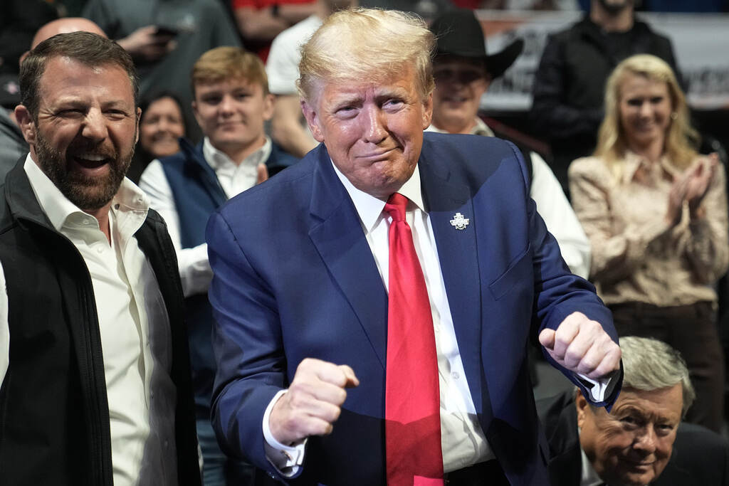 Donald J. Trump, Markwayne Mullin Trump gestures to someone.