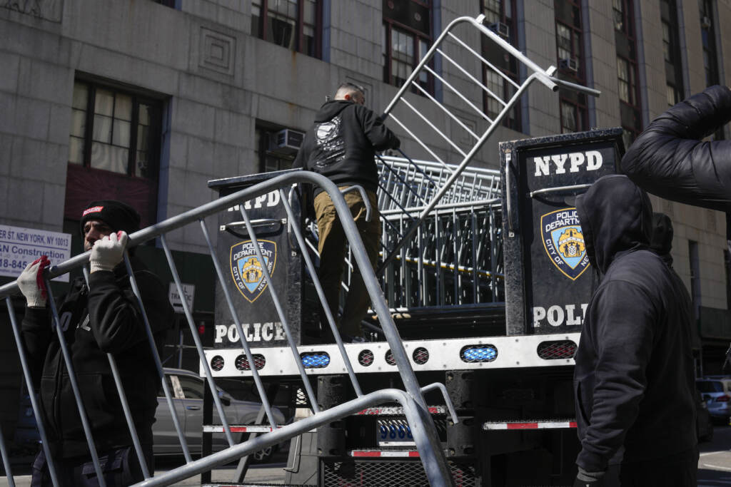 Trump Legal Troubles Barricades are unloaded from a truck near the courts in New York