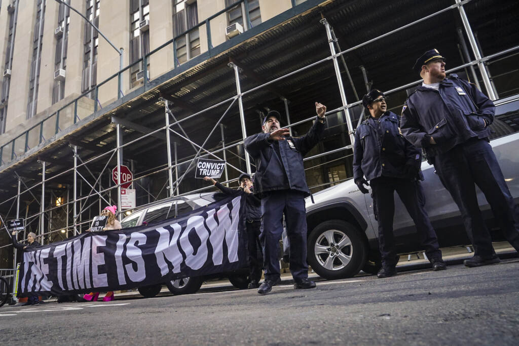 Trump Indictment Demonstrators unveil a banner outside Manhattan's district attorney office, supporting a grand jury vote to indict former President Donald Trump