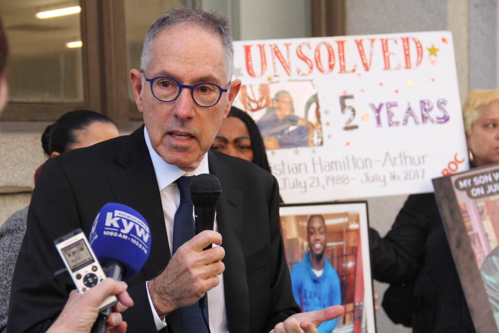 Untermeyer speaks into a microphone.
