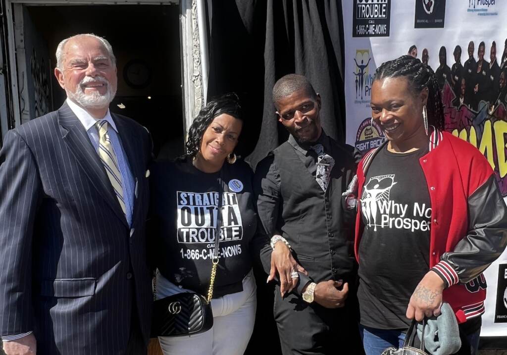 why-not-prosper Byron Cotter, Michelle Anne Simmons, Marcus Pearson and Delia Avery pose for a photo outdoors.