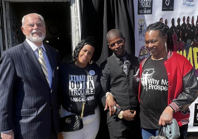 Byron Cotter, Michelle Anne Simmons, Marcus Pearson and Delia Avery pose for a photo outdoors.