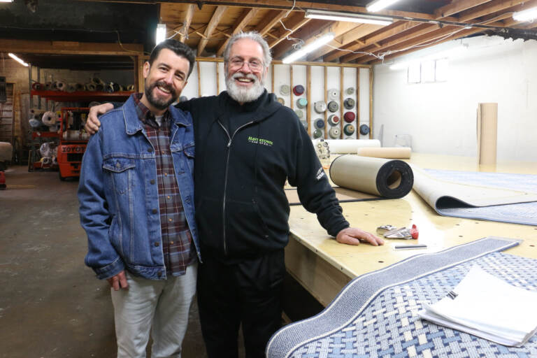 Father and son in a workshop.