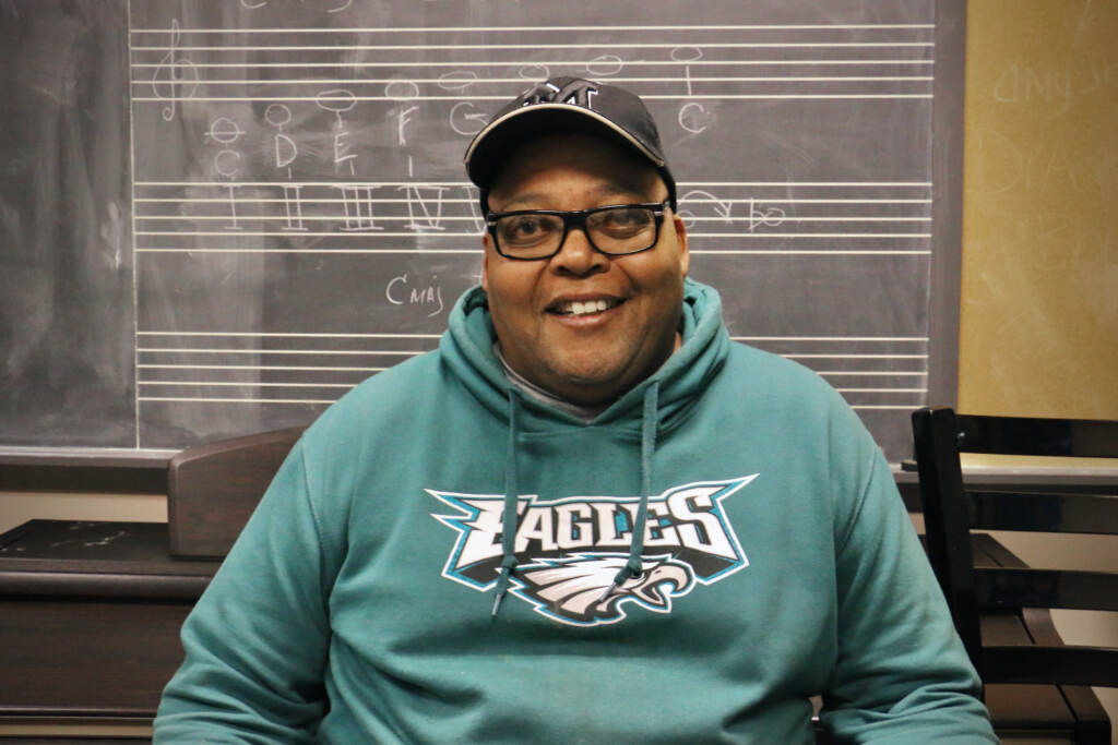 Michael Barnes smiles, posing for a photo.