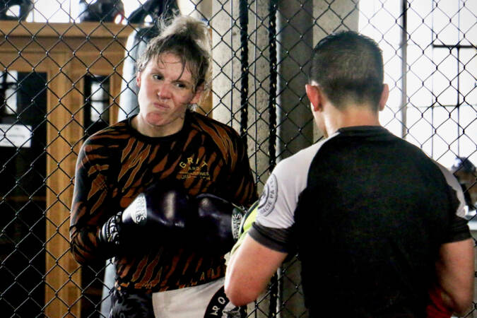 DeAnna Bennett squares off against teammate Eugene Hong during a practice bout at Marquez MMA Gym