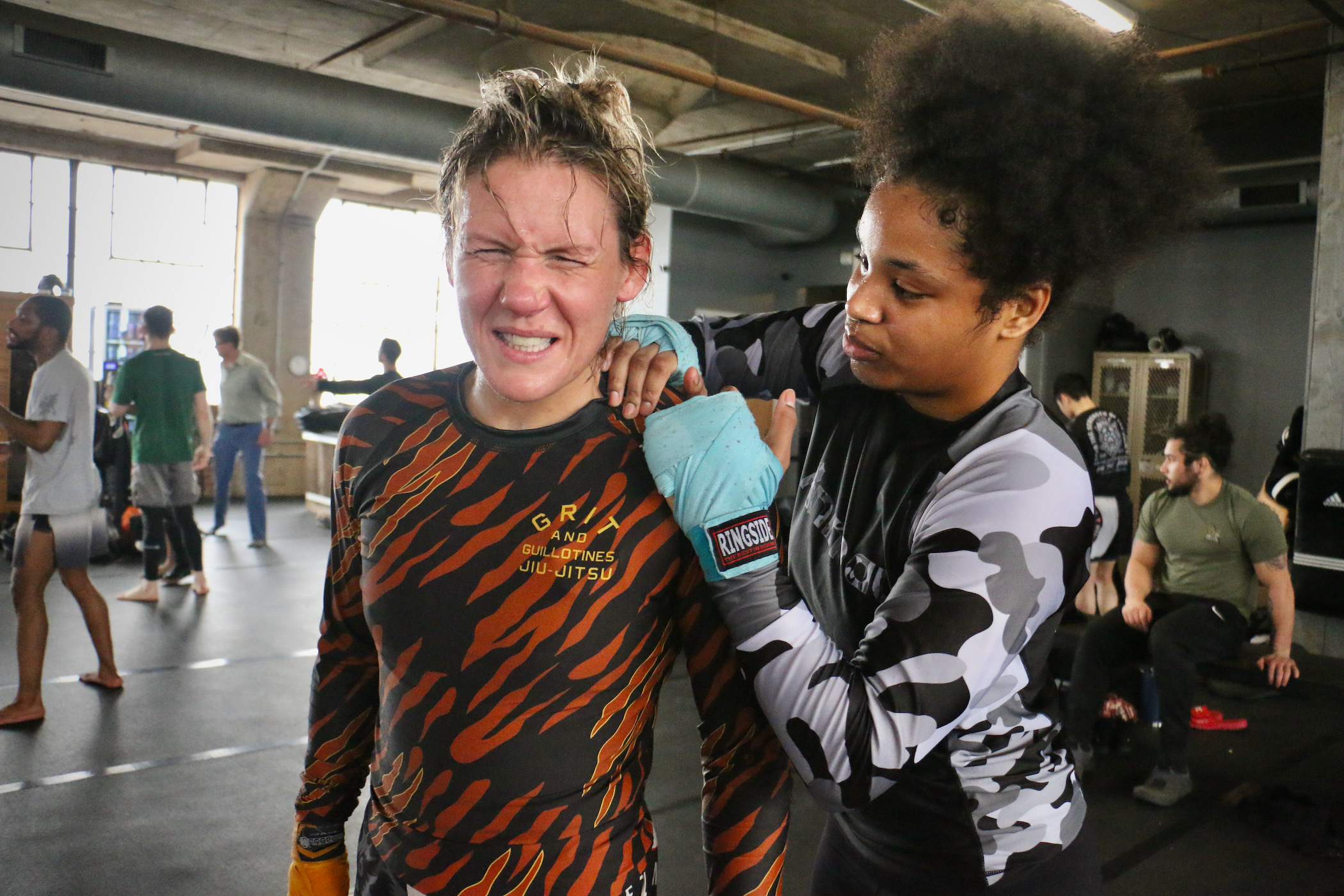 DeAnna Bennett (left) gets a post-workout massage from teammate Katana La Torre
