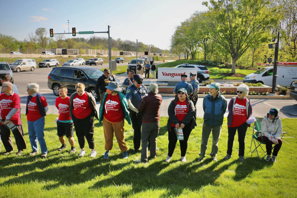2023 04 19-e lee-tredyffrin pa vanguard-climate protest arrests wide Tredyffrin Township police arrest protesters at the Matthews Road entrance to Vanguard offices. (Emma Lee/WHYY)