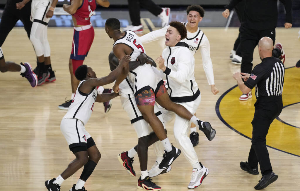 APTOPIX NCAA Florida Atlantic San Diego St Basketball San Diego State guard Lamont Butler (5) celebrates with teammates after hitting the winning basket against Florida Atlantic during the second half of a Final Four college basketball game in the NCAA Tournament on Saturday, April 1, 2023, in Houston