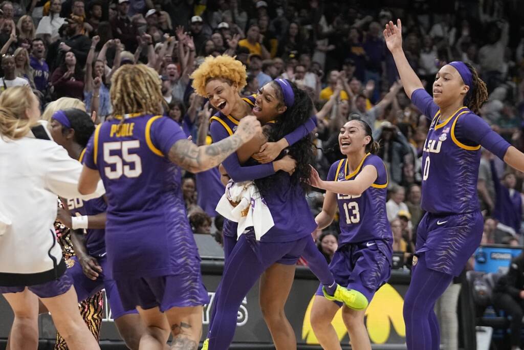 NCAA LSU Iowa Basketball LSU players celebrate a last second shot during the first half of the NCAA Women's Final Four championship basketball game against Iowa Sunday, April 2, 2023, in Dallas. (AP Photo/Darron Cummings)