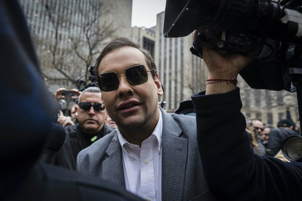 Rep. George Santos, R-N.Y., walks past the criminal courthouse at 100 Center Street in New York on Tuesday, April 4, 2023