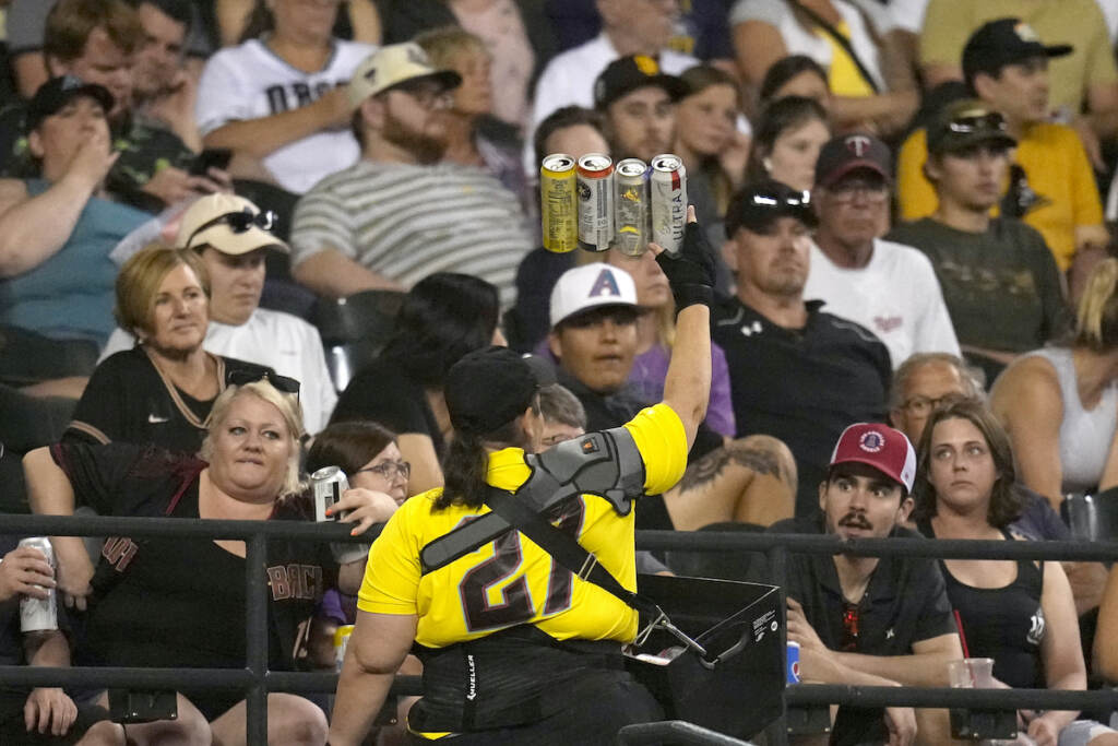 Beer Sales Eighth Inning A beer vendor walks through the stands during the seventh inning of a baseball game between the Arizona Diamondbacks and the Milwaukee Brewers