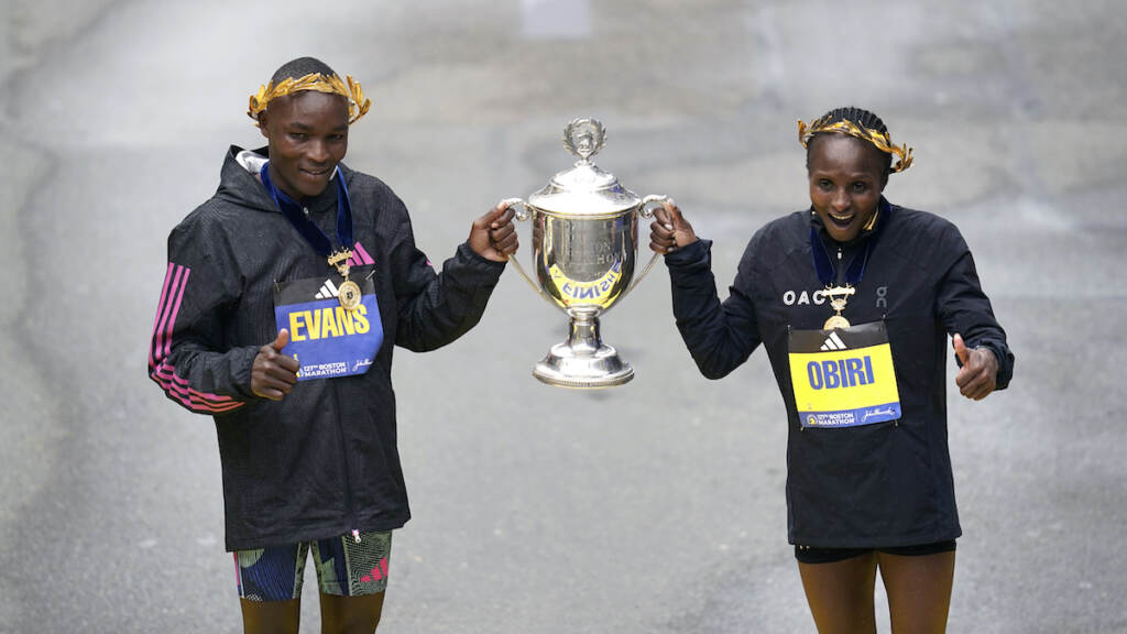 Boston Marathon Evans Chebet (left) and Hellen Obiri, both of Kenya, pose on the finish line after winning the men's and women's division of the Boston Marathon