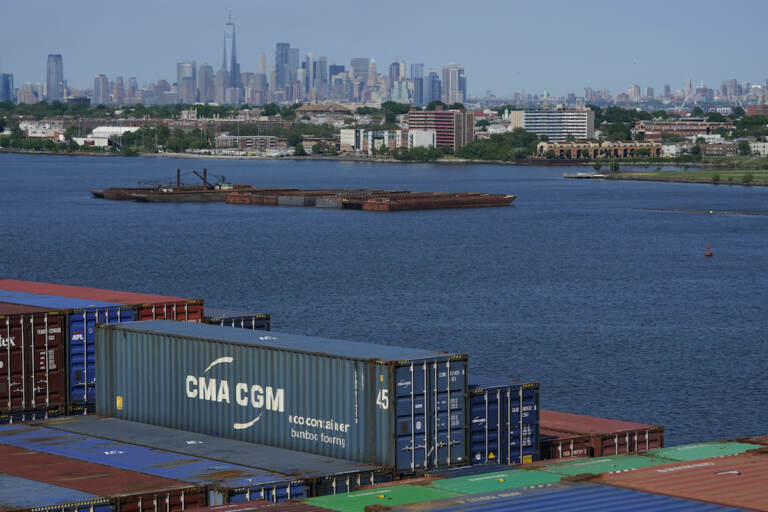 New York City is visible over the containers stacked on the CMA CGM Marco Polo in Elizabeth, N.J.