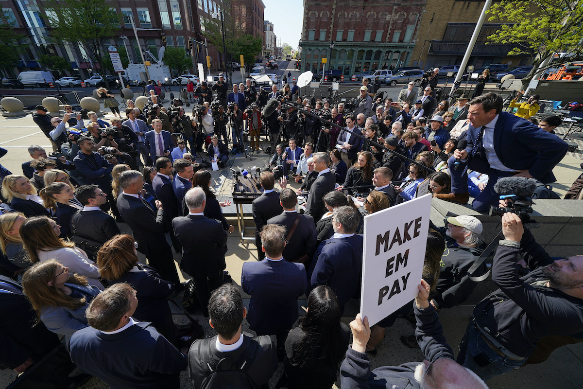 Fox Dominion Lawsuit Reporters surround attorneys for Dominion Voting Systems during a news conference outside the New Castle County Courthouse in Wilmington, Del.
