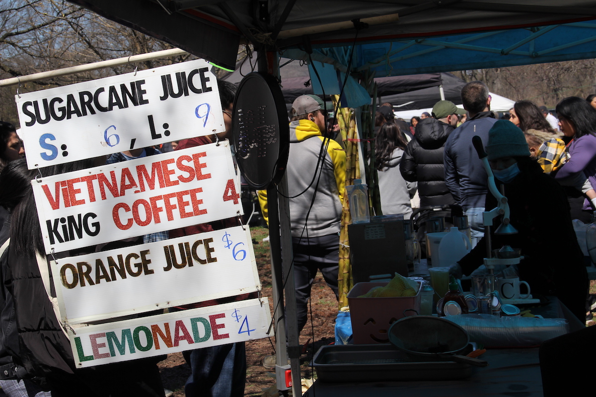 A sign for various beverages available from a from at the Southeast Asian Market.