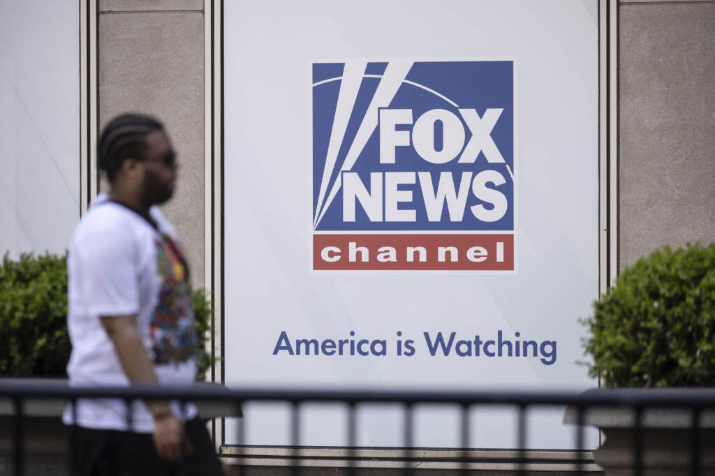 A person walks past the Fox News Headquarters.