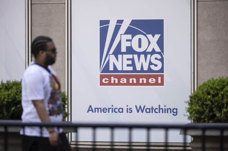 A person walks past the Fox News Headquarters.