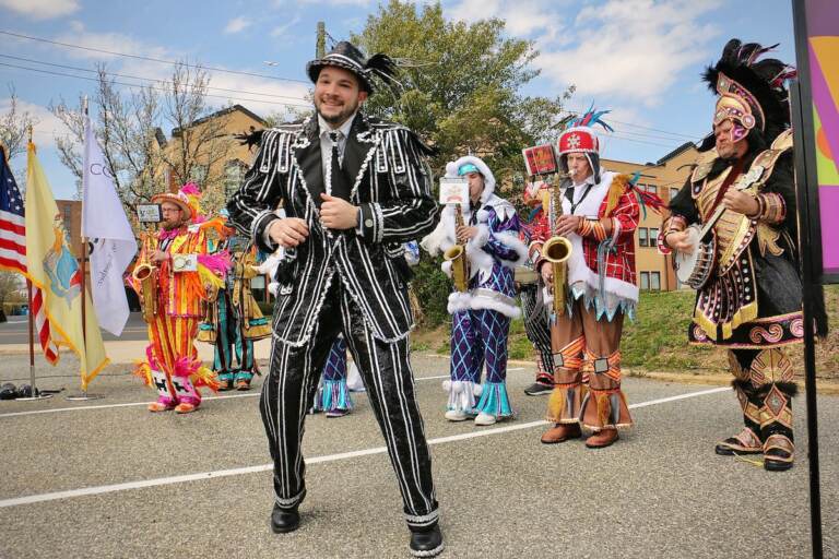 Members of the Philadelphia String Band Association, dressed in elaborate costumes, strut in Haddon Township
