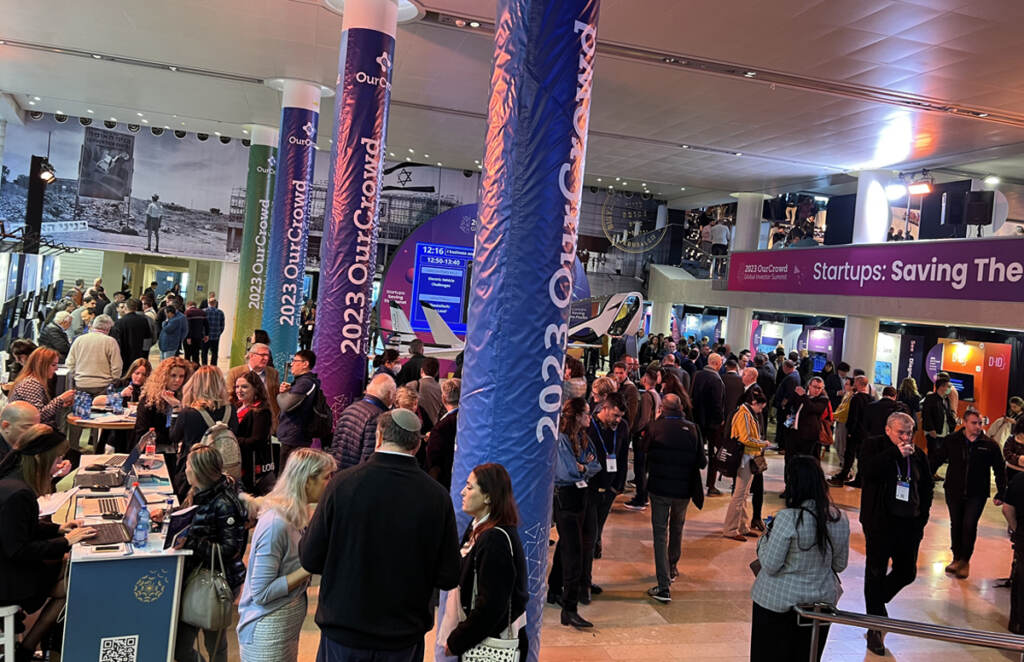 People gather together in a large room.