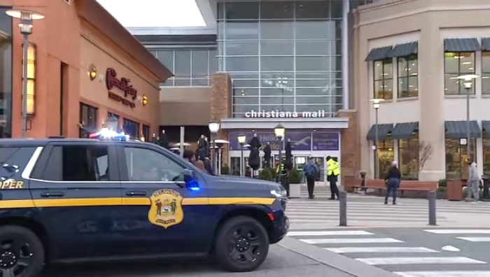 christiana-mall-shooting A police car outside of a mall building.