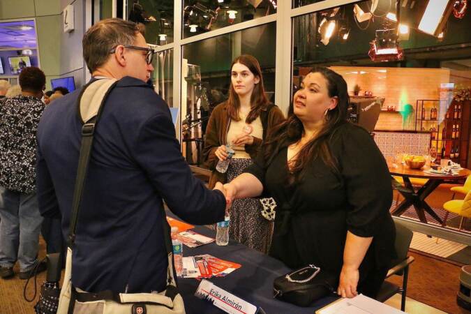 Philadelphia City Council Candidate Erika Almiron shakes hands with someone.