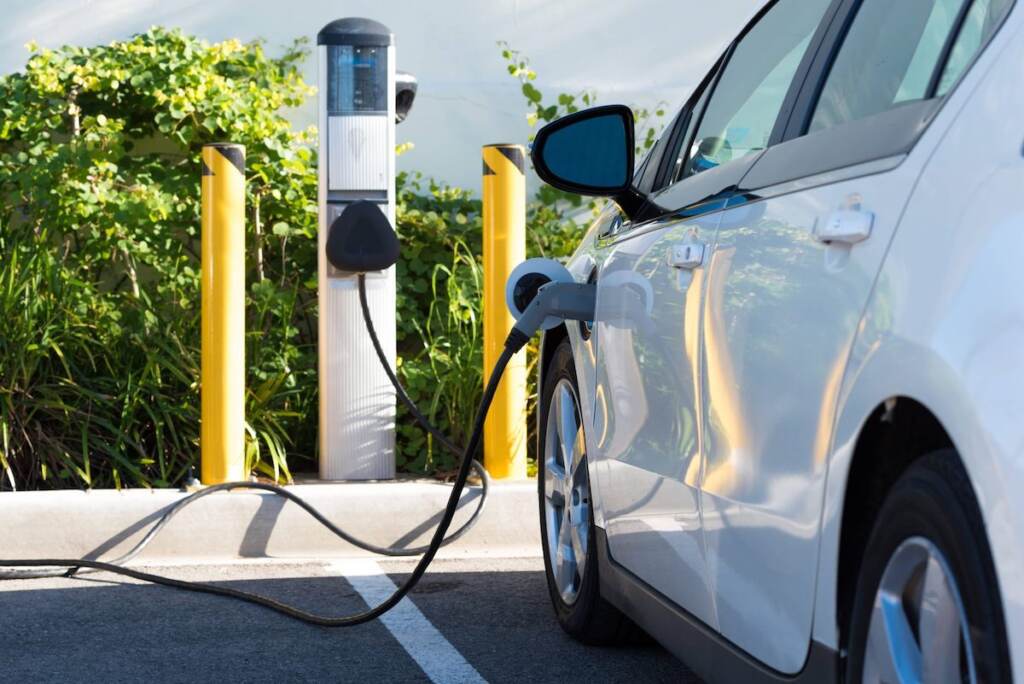 delaware-ev-2 An up-close view of an electric car that's connected to an EV charging station.