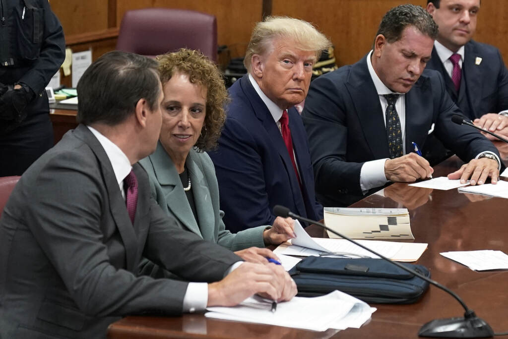 Trump Indictment Former President Donald Trump sits at the defense table with his defense team in a Manhattan court