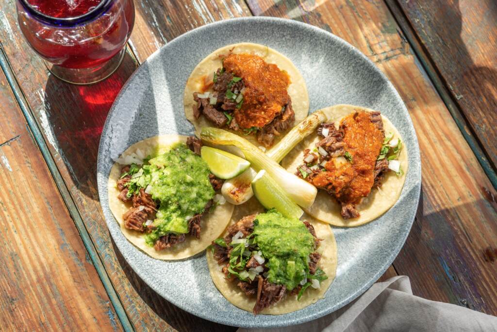 elchingon-tacos An overhead view of tacos arranged on a plate.