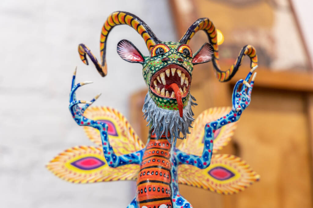 eyesgallery-southstreet-001 A close-up of a painted paper maché fantastical creature.