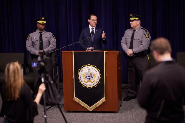 Gov. Shapiro stands at a podium giving a speech