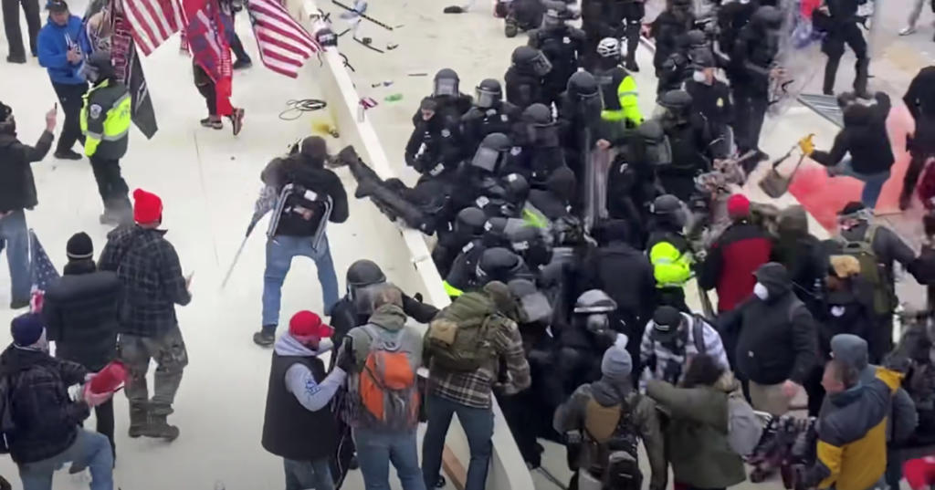 firefighter_fire_extinguisher_assault_capitol_siege_011421-1920×1006 YouTube footage cited in an FBI document reportedly captures Sanford, bottom left, as he hurls an object at Capitol Police. (Youtube)