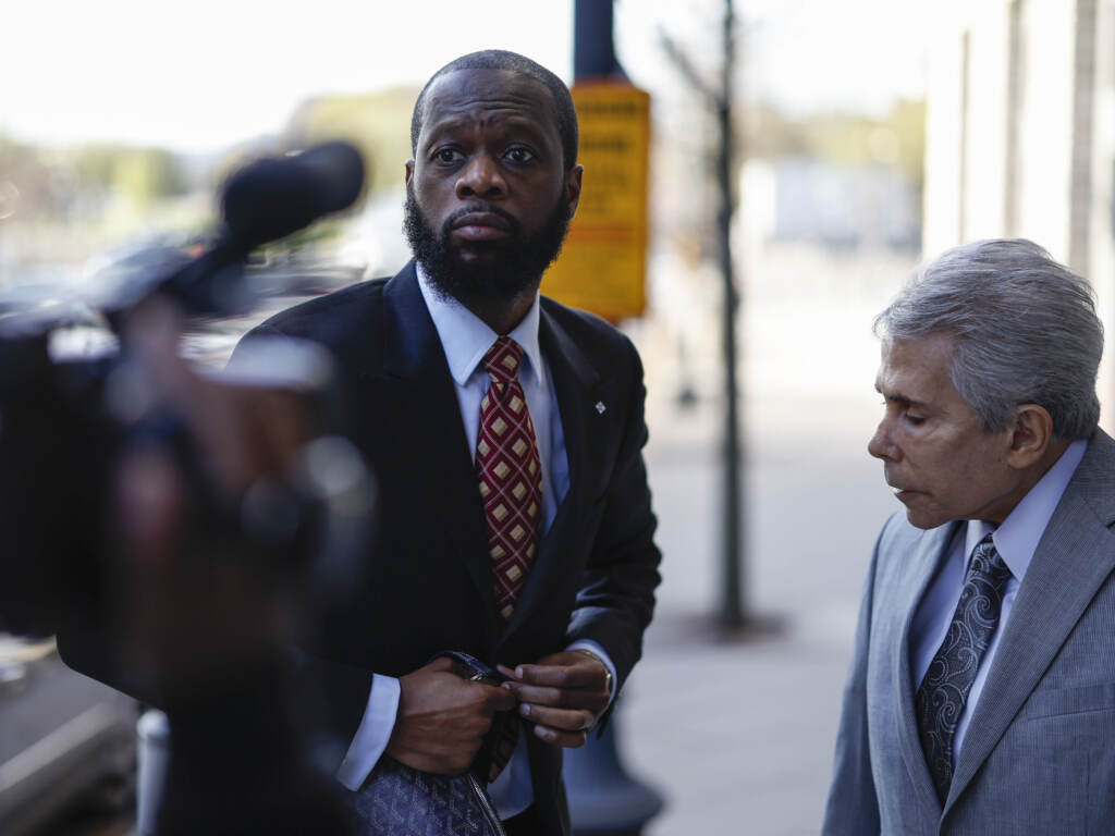 Pras Michel, former member of the Fugees, center, and his lawyer David Kenner arrive to federal court in Washington, D.C., on April 3, 2023. Pras Michel, former member of the Fugees, center, and his lawyer David Kenner arrive to federal court in Washington, D.C., on April 3, 2023.