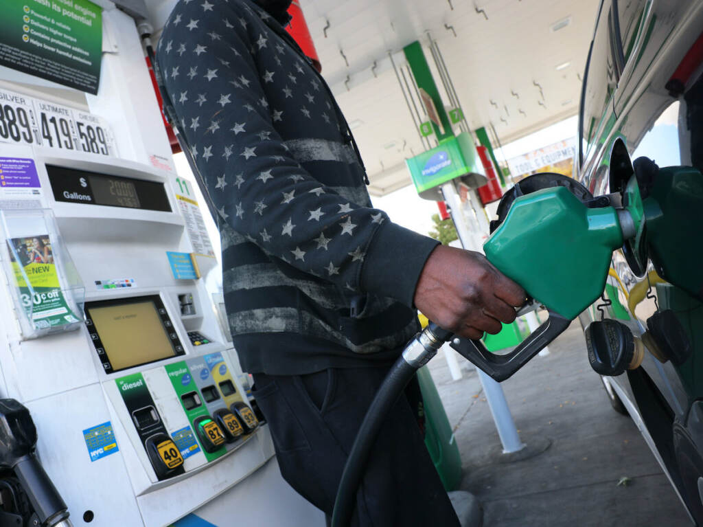 Strategic Petroleum Reserves Release Ordered By President Biden To Curb Rises Gas Prices person prepares to pump gas at a BP gas station
