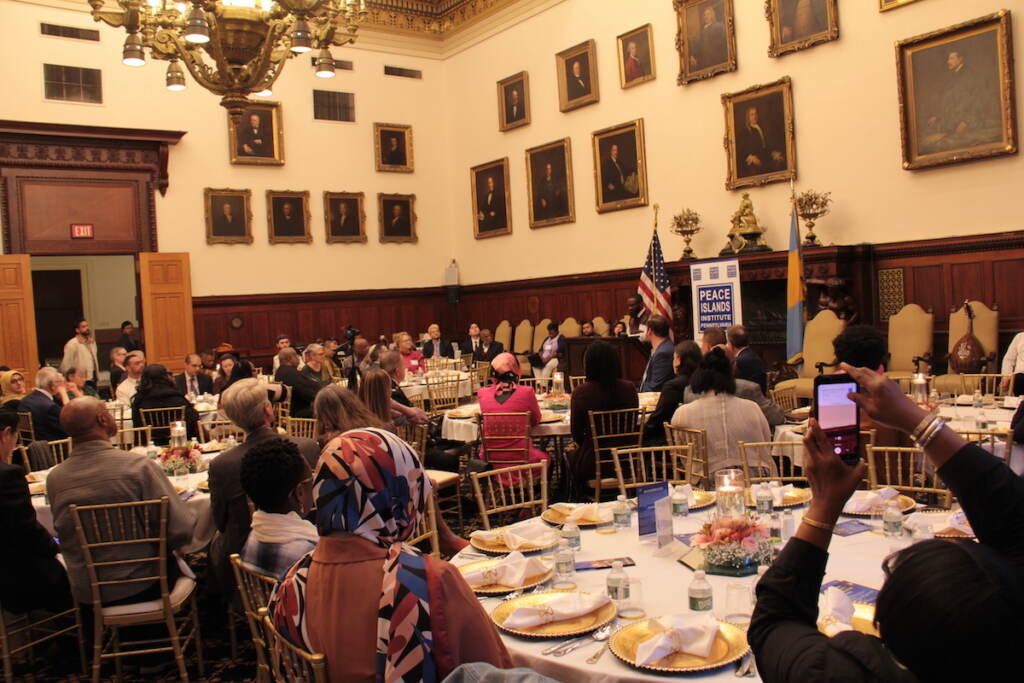 iftar-9 A room full of people seated at tables.