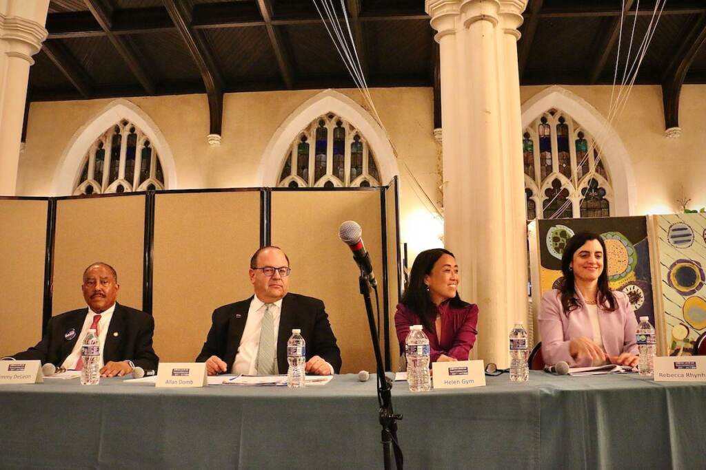 mayoral-forum-housing-1 Jimmy DeLeon, Allan Domb, Helen Gym, and Rebecca Rhynhart sit in a row at a table.