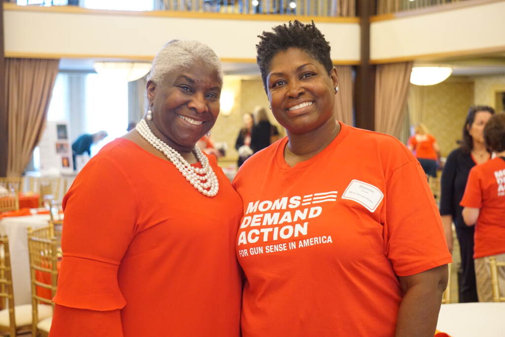 moms-demand-rally-s-searles-2023-04-23-md1 2 women posing at a Moms Demand Action event.