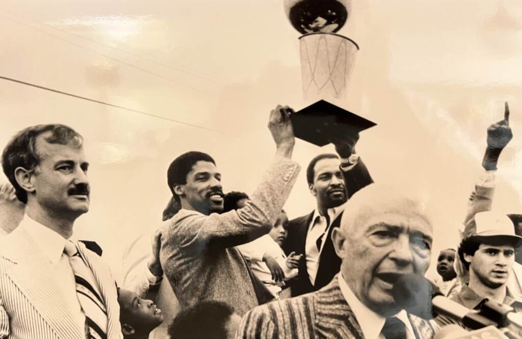 sixers-history1983-ronrabena-scaled Members of the Philadelphia 76ers raise the NBA championship trophy in 1983,