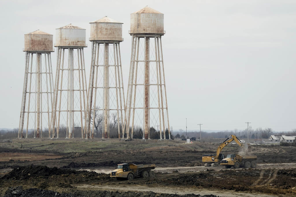 Record Subsidies States Factory towers are visible on the horizon.