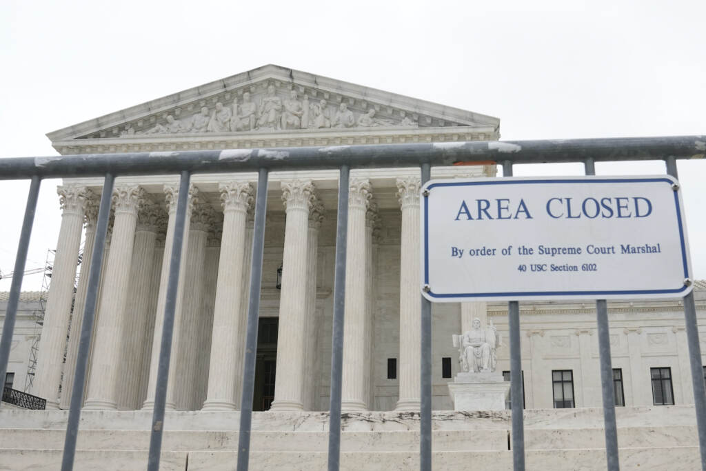 Supreme Court A sign outside the Supreme Court building saying it's closed.