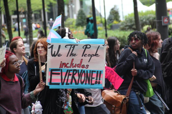 Students and transgender advocates circled around City Hall on Apr. 25, 2023, halting traffic and demanding multiple Pa. House Bills be vetoed. (Cory Sharber/WHYY)