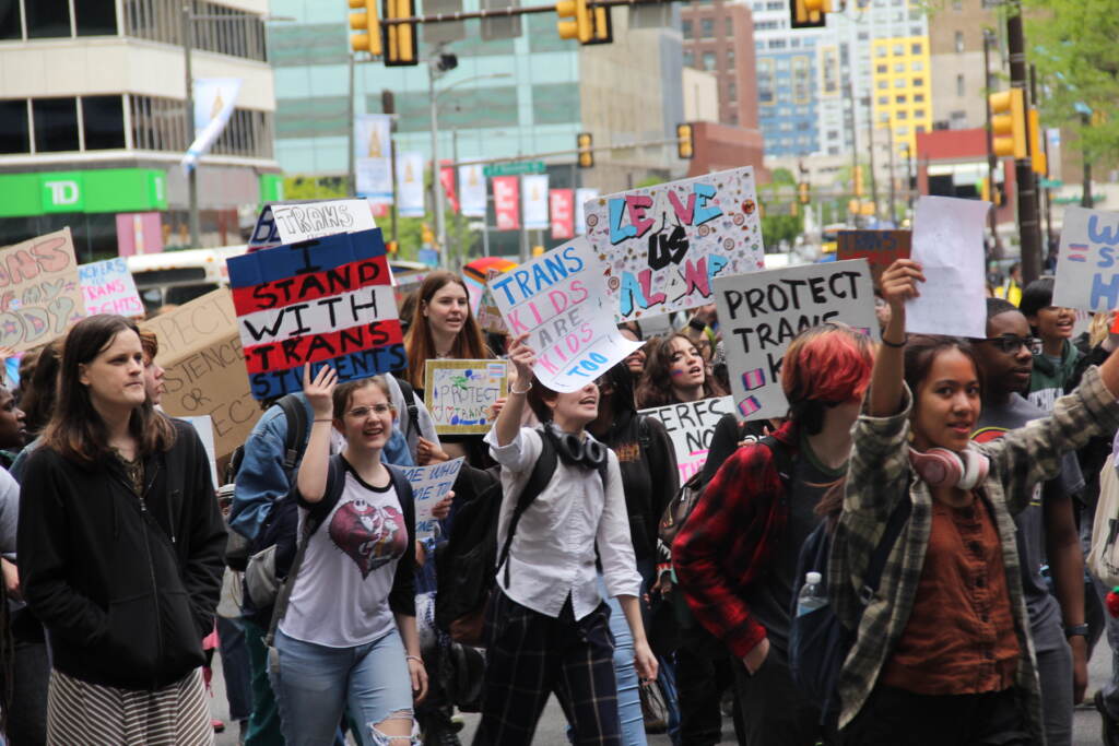 Students and transgender advocates circled around City Hall on Apr. 25, 2023, halting traffic and demanding multiple Pa. House Bills be vetoed. (Cory Sharber/WHYY)