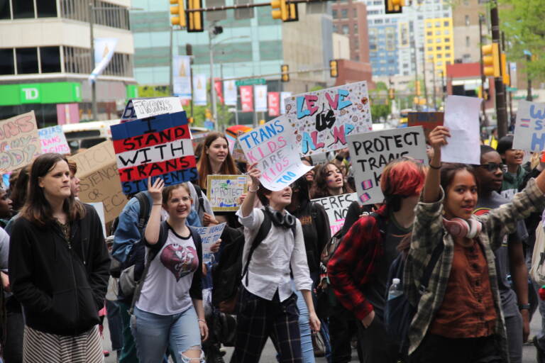Students and transgender advocates circled around City Hall on Apr. 25, 2023, halting traffic and demanding multiple Pa. House Bills be vetoed. (Cory Sharber/WHYY)