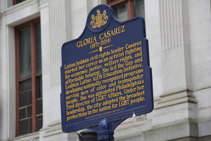 Students spoke next to a marker noting Philly LGBTQ+ civil rights icon Gloria Casarez. (Cory Sharber/WHYY)