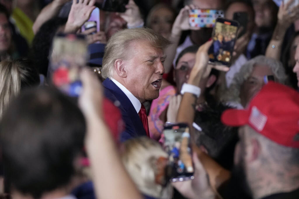 Donald Trump Trump surrounded by his supporters at Mar-a-Lago after returning from New York for his arraignment.