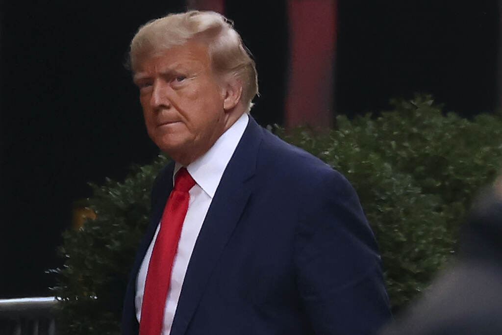 APTOPIX Trump Indictment Former President Donald Trump arrives at Trump Tower, Monday, April 3, 2023, in New York. Trump arrived in New York on Monday for his expected booking and arraignment the following day on charges arising from hush money payments during his 2016 campaign. (AP Photo/Yuki Iwamura)