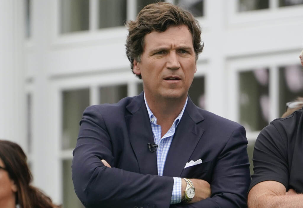 Tucker Carlson on a golf course.