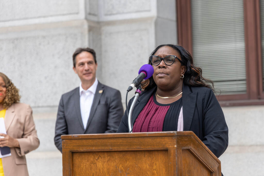 Kendra Brooks speaks at a podium.
