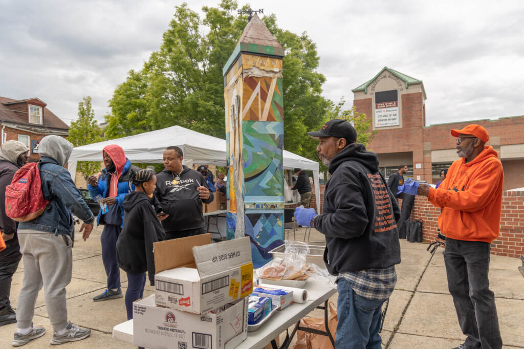 Members of the community talking at a block party.